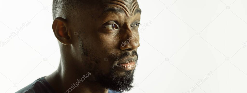 African-american young mans close up shot on studio background, flyer