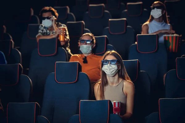 Cinema, movie theatre during quarantine. Coronavirus pandemic safety rules, social distance during movie watching — Stock Photo, Image