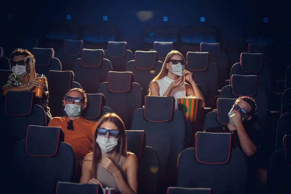 Cinema, movie theatre during quarantine. Coronavirus pandemic safety rules, social distance during movie watching — Stock Photo, Image