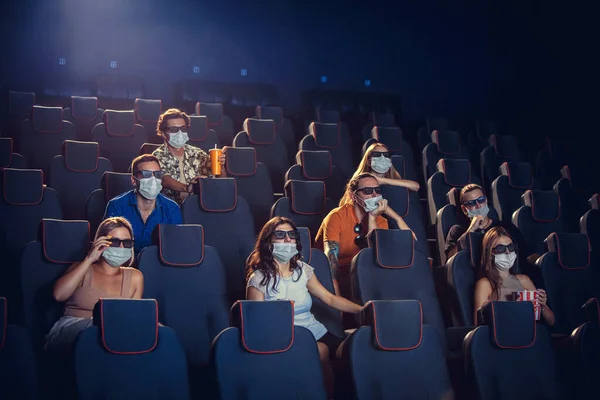 Cinema, movie theatre during quarantine. Coronavirus pandemic safety rules, social distance during movie watching — Stock Photo, Image