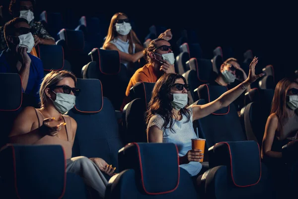 Cinema, movie theatre during quarantine. Coronavirus pandemic safety rules, social distance during movie watching — Stock Photo, Image