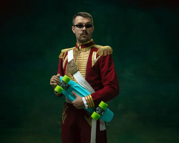 Young man as Nicholas II on dark green background. Retro style, comparison of eras concept. — Stock Photo, Image