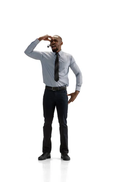 Young african-american call center consultant with headset isolated on white studio background — Stock Photo, Image