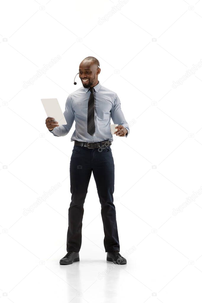 Young african-american call center consultant with headset isolated on white studio background