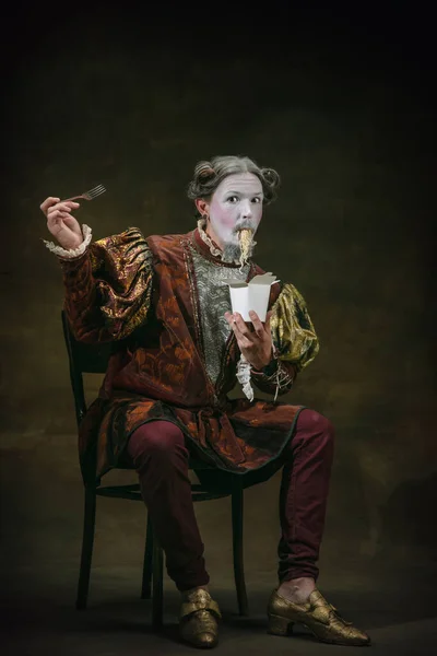 Young man as Johann Sebastian Bach on dark green background. Retro style, comparison of eras concept. — Stock Photo, Image