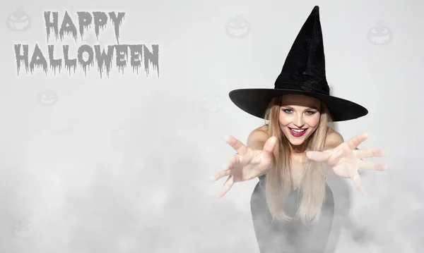 Young woman a witch on scary background — Stock Photo, Image