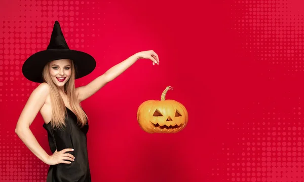 Young woman a witch on scary background — Stock Photo, Image