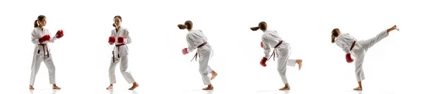 Pewny siebie juniorek w kimono praktykujący walki taekwondo, sztuki walki — Zdjęcie stockowe