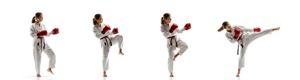 Pewny siebie juniorek w kimono praktykujący walki taekwondo, sztuki walki — Zdjęcie stockowe