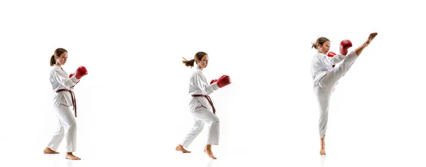 Zelfverzekerde junior in kimono beoefenen taekwondo gevechten, vechtsporten — Stockfoto