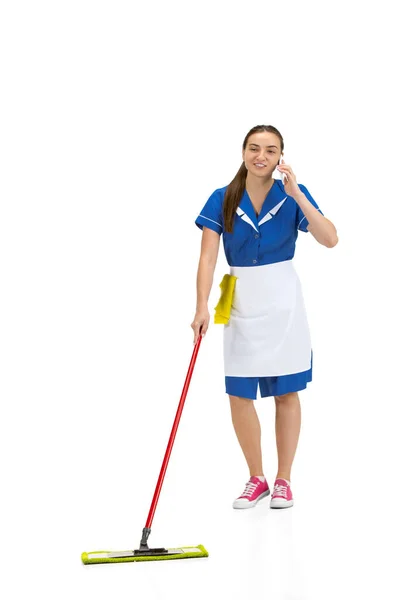Portrait of female made, cleaning worker in white and blue uniform isolated over white background — Stock Photo, Image