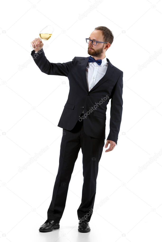 Portrait of male sommelier in suit isolated over white background