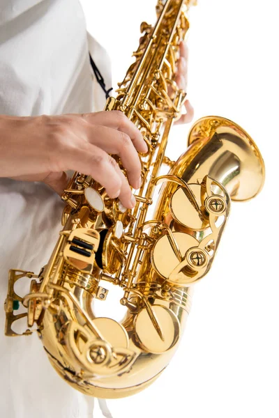 Close up woman playing saxophone isolated on white studio background — Stock Photo, Image