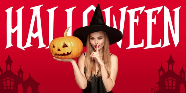 Young woman in hat as a witch on scary red background — Stock Photo, Image