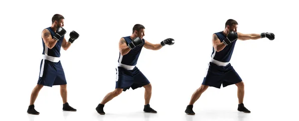 Joven boxeador contra fondo de estudio blanco en movimiento de patadas paso a paso — Foto de Stock