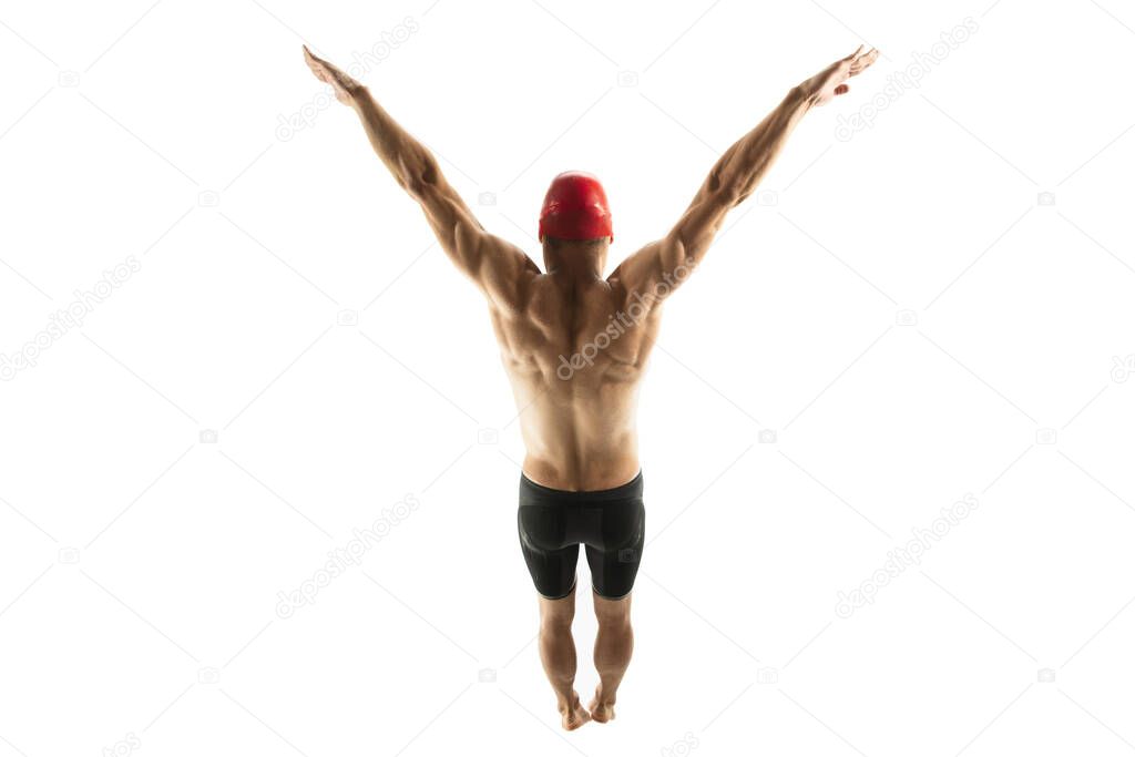 Caucasian professional sportsman, swimmer training isolated on white studio background