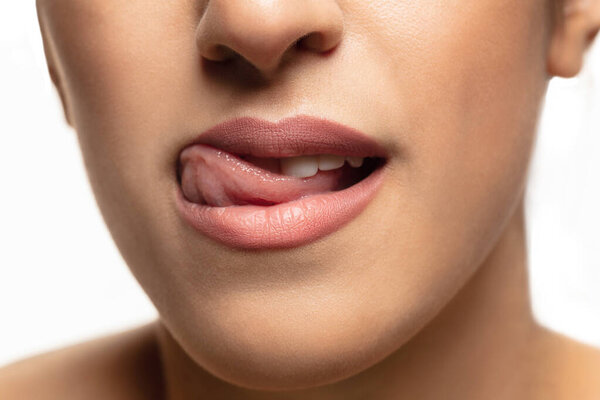 Close-up shoot of beautiful female lips with natural lipstick make up