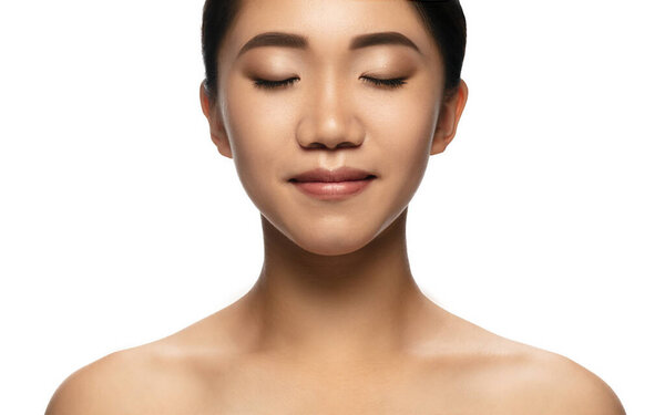 Portrait of beautiful asian woman isolated on white studio background. Beauty, fashion, skincare, cosmetics concept.