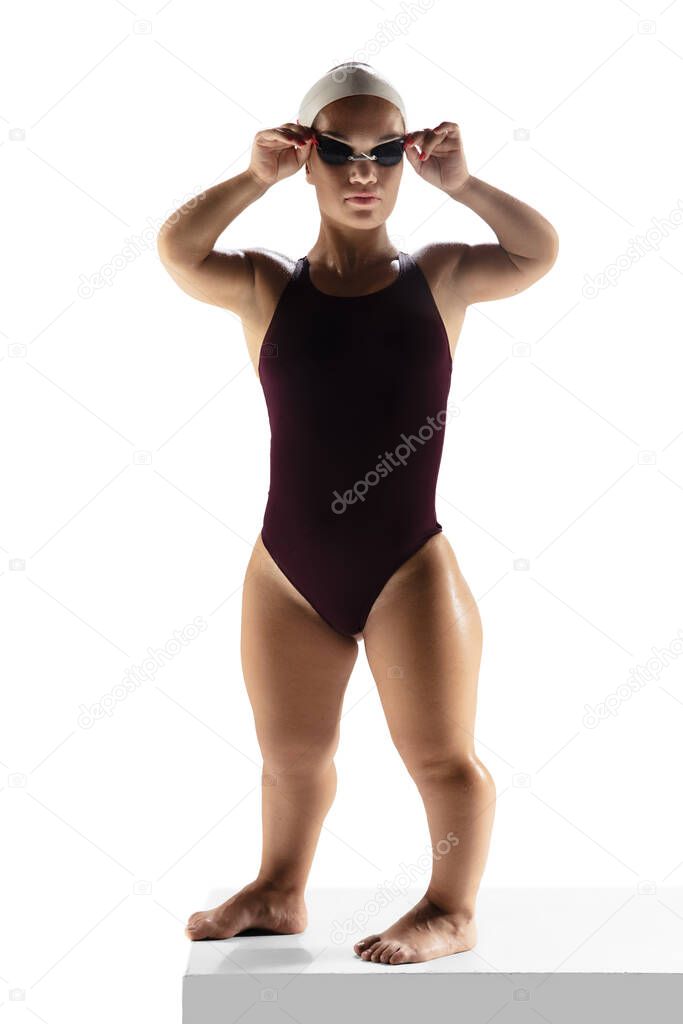 Beautiful dwarf woman practicing in swimming isolated on white background