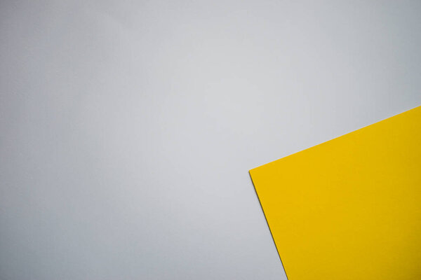 Yellow and white geometric, colored paper