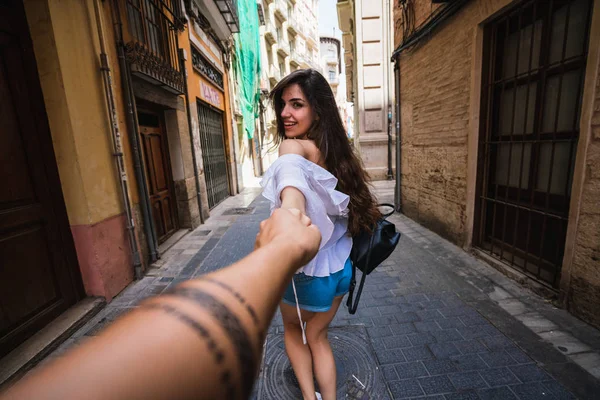 Cute Young Brunette Smiling Holding Hand Anonymous Person While Leading — Stock Photo, Image