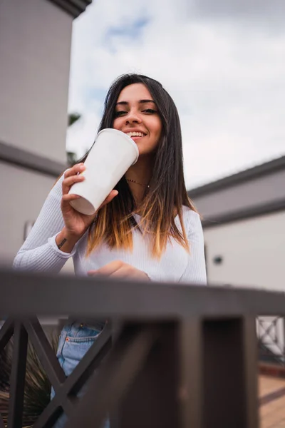 Lovely Young Brunette Smiling Looking Camera While Enjoying Delicious Beverage Royalty Free Stock Photos
