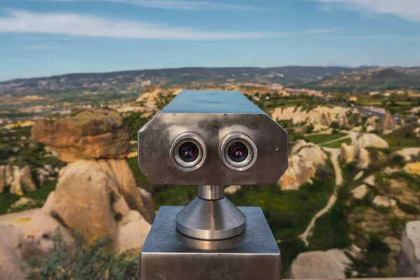 Binoculars in countryside observation point