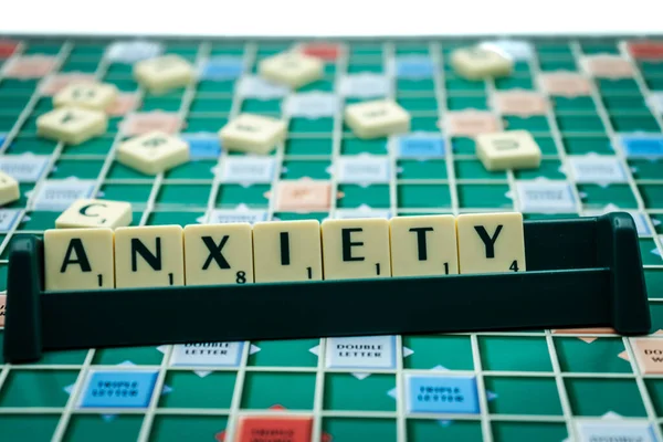 02/09/2020 Portsmouth, Hampshire, UK The word anxiety spelled out in scrabble tiles on a scrabble board