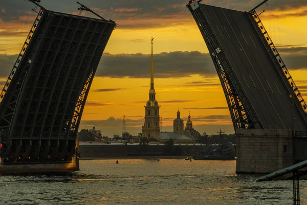 Peter and Paul Fortress with opened bridge at sunrise