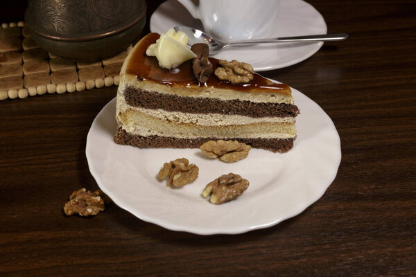 Biscuit cake with chocolate, maple syrup and walnuts.