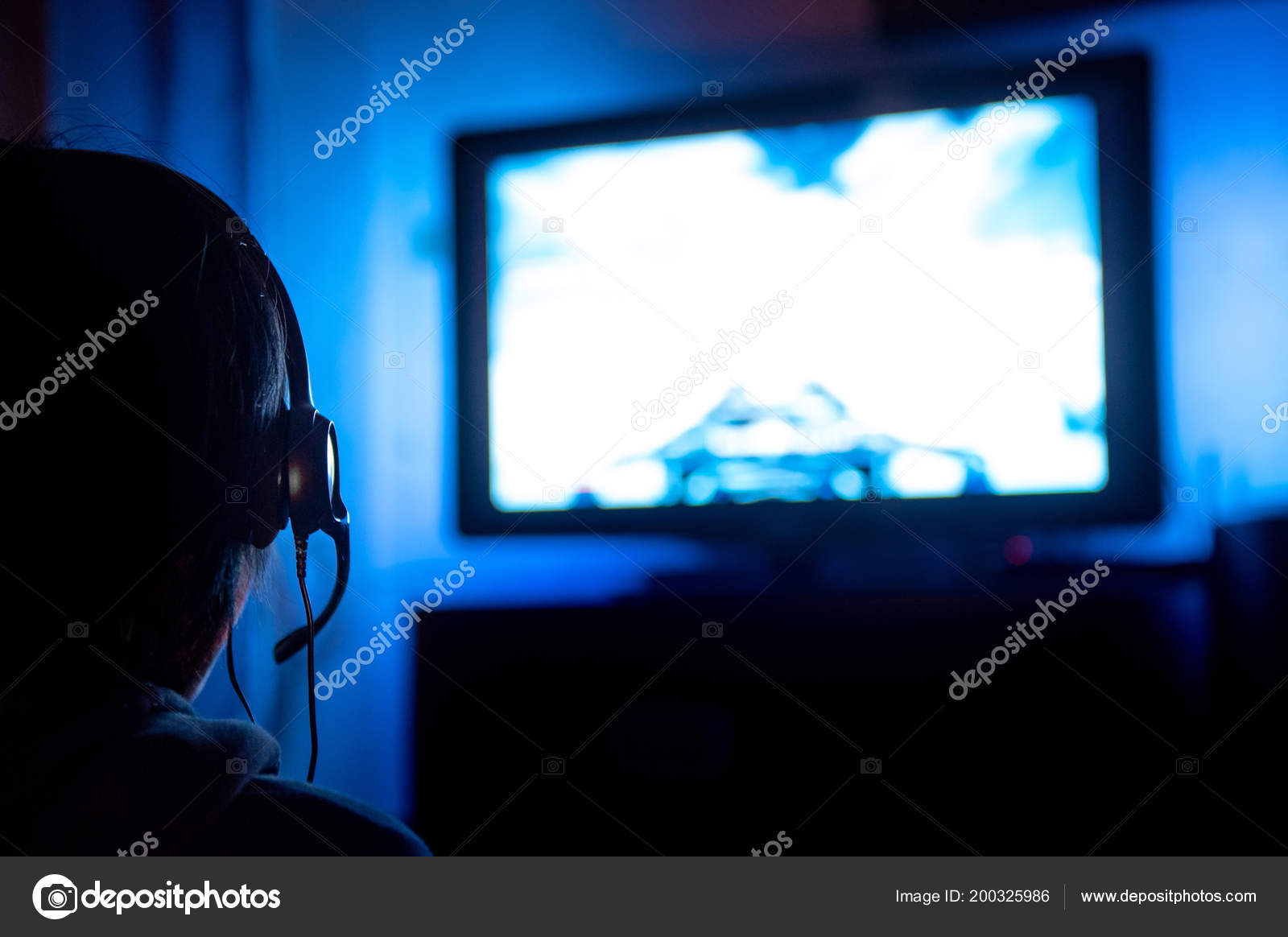 Young Male Gamer Glasses Headset Playing Video Game Home