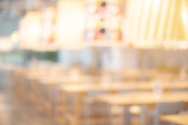 Soyut bulanık Restoran arka plan. Bulanık kafe ya da kafe masa, sandalye ve diğer dekorasyon. Tasarım öğesi için zemin bulanıklık. Yiyecek ve içecek konsepti.