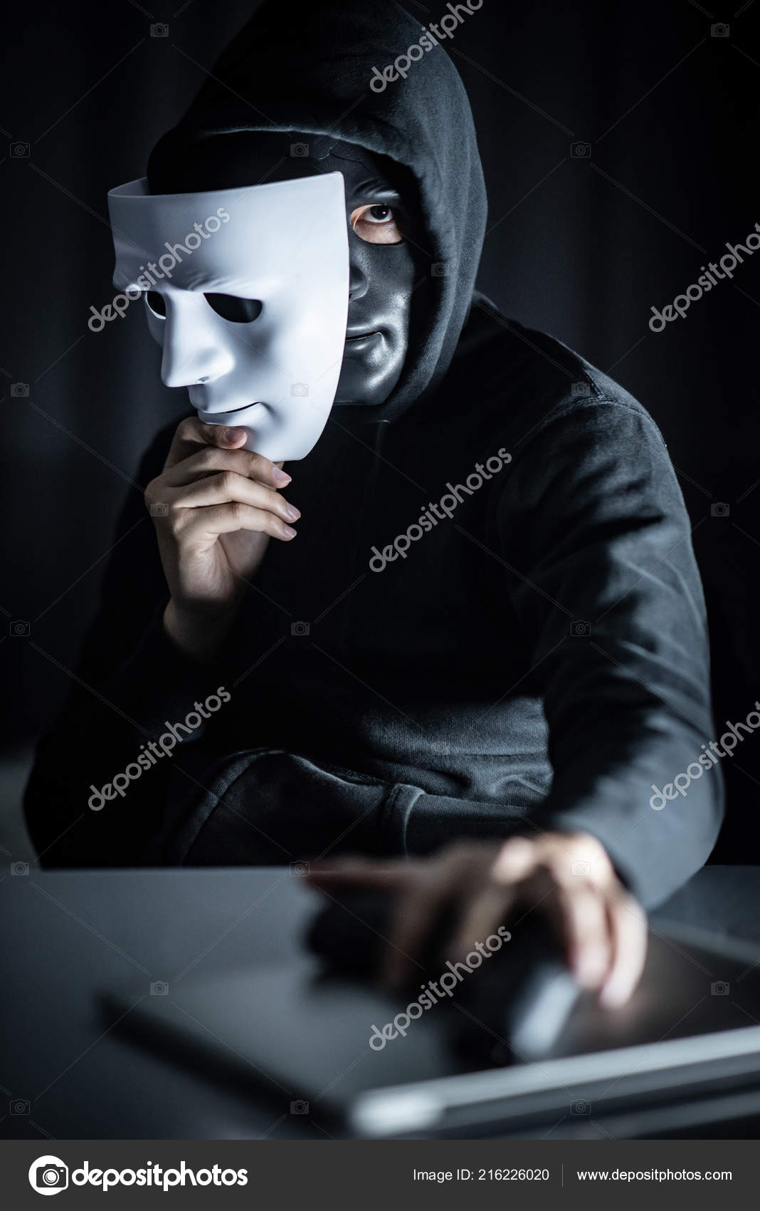 Mystery Man in Black Mask Holding White Masks Stock Image - Image