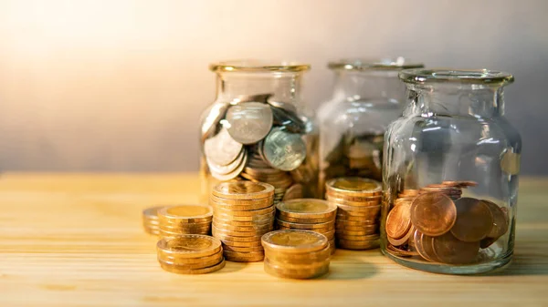 Coins Currency Glass Jars Stack Wooden Table Saving Money Future — Stock Photo, Image