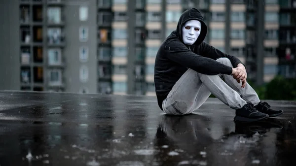 Reflection Mystery Hoodie Man White Mask Hugging His Knees Sitting — Stock Photo, Image