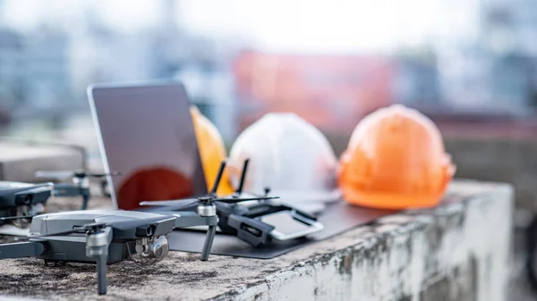 Drone Remote Control Laptop Computer Smartphone Protective Helmet Construction Site — Stock Photo, Image