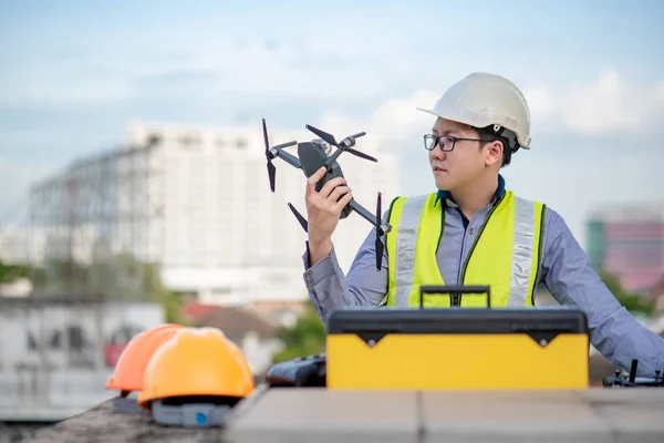 Asian engineer man using drone for site survey