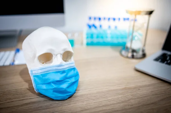 Human Skull Cranium Head Wearing Blue Surgical Mask Test Tube — Stock Photo, Image