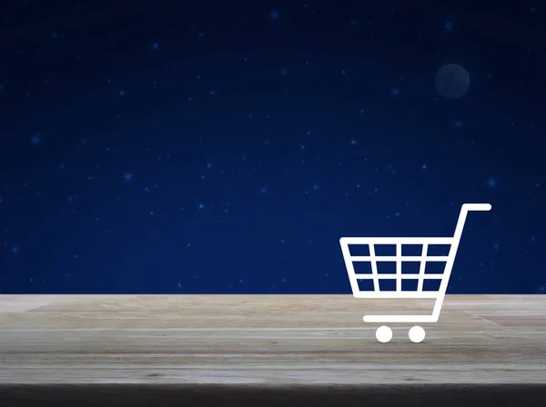 ファンタジー夜空と月 オンライン ショップのコンセプトに木製のテーブルの上の買物車アイコン — ストック写真