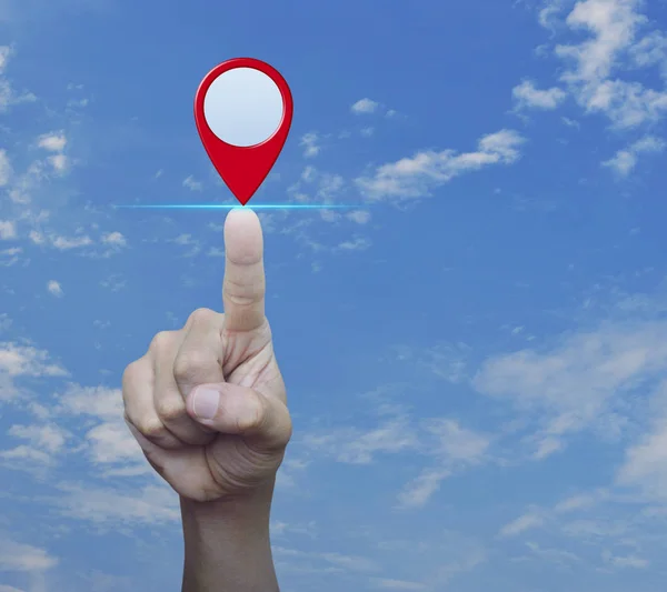 Hand pressing map pin location button over blue sky with white clouds, Map pointer navigation concept