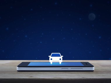 Taksi araba düz üstünde kutsal kişilerin resmi modern akıllı cep telefonu ekran fantezi gece gökyüzü ve ay üzerinde ahşap masa üzerinde iş ulaşım hizmet online kavramı
