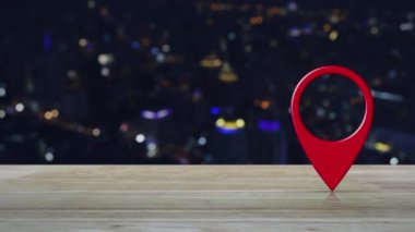 Bulanıklık renkli gece ışığı modern şehir kulesi ve gökdelen üzerinde ahşap masa üzerinde Harita pin noktası konumu düğmesi, Harita işaretçisi navigasyon konsepti