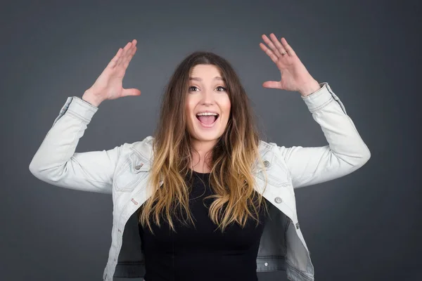 Portrait Beautiful Caucasian Woman Looks Excitement Camera Keeps Hands Raised — Stock Photo, Image