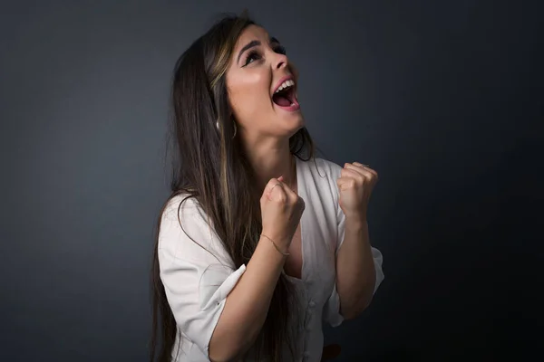 Brunette Girl Excited Glad Achieve Victory Clenches Fists Screams Excitement — Stock Photo, Image