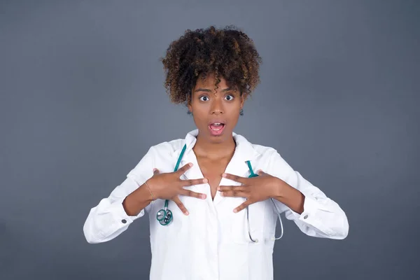 Shocked Scared Beautiful African American Doctor Woman Keeps Hands Chest — Stock Photo, Image