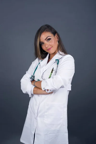 Waist up shot of beautiful self confident cheerful young doctor woman