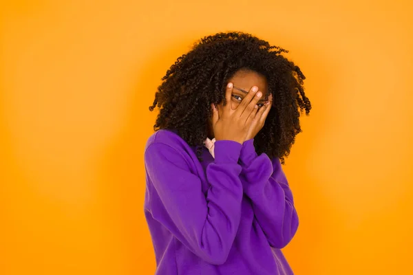 African American Female Hides Her Face Yellow Background Emotions Gestures — Stock Photo, Image