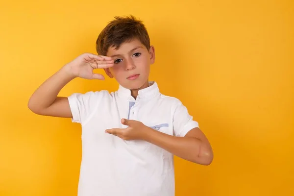 Cute Boy Showing Something Yellow Wall — Stock Photo, Image