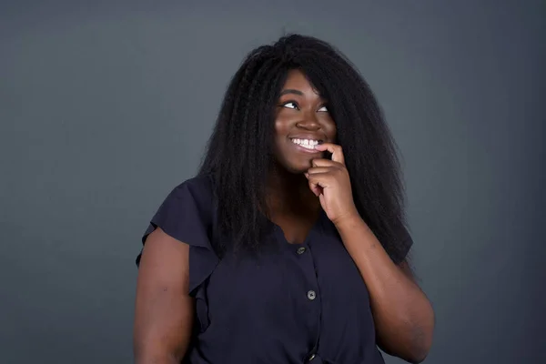 Dreamy African American Woman Thoughtful Expression Looks Camera Keeps Hand — Stock Photo, Image