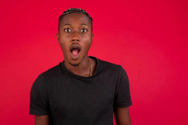 African American Man Wearing Black Shirt Red Background Opened Mouth — Stock Photo, Image